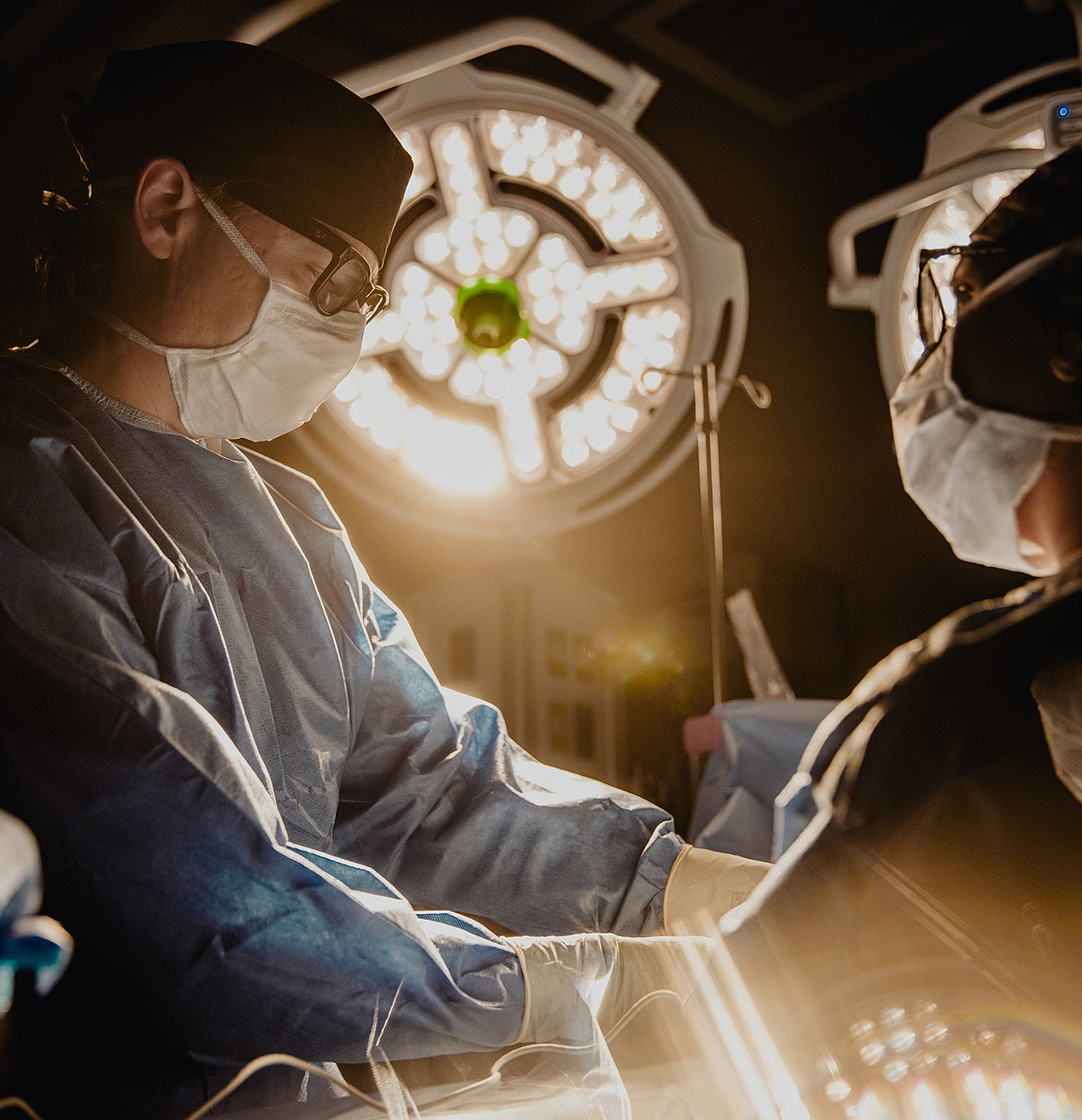 Surgeons performing a procedure in an operating room.