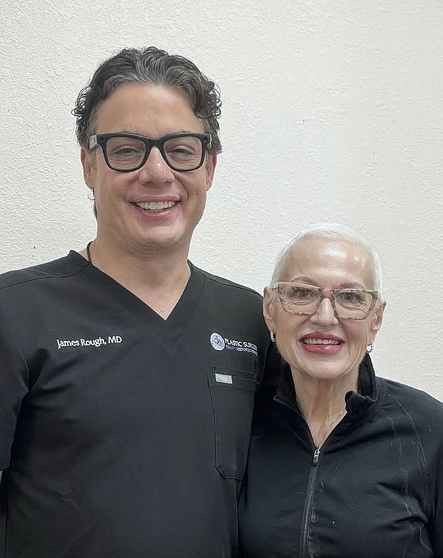 Doctor and patient smiling together in clinic.