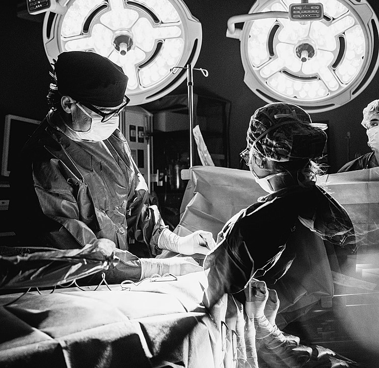Surgeons performing an operation in a hospital.