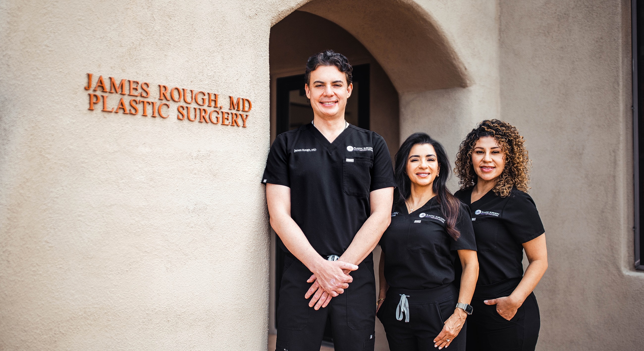 Medical team outside plastic surgery office.
