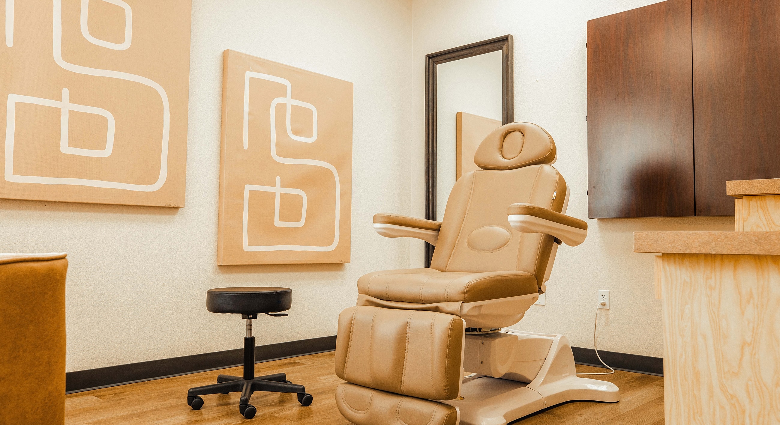 Modern treatment room with adjustable chair.