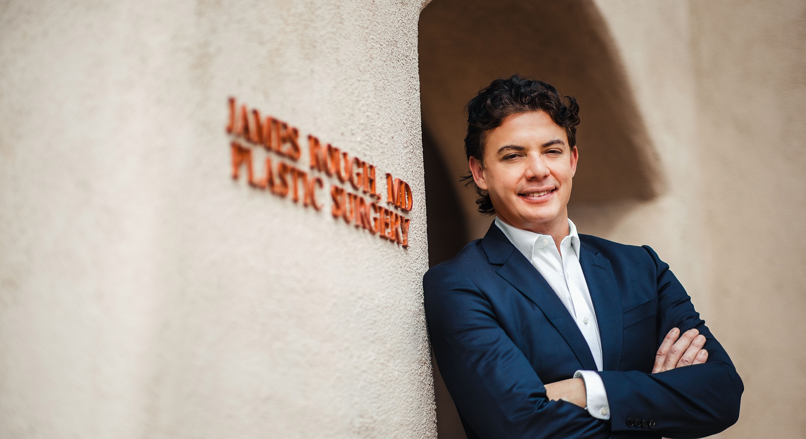 Portrait of a plastic surgeon outside his clinic.