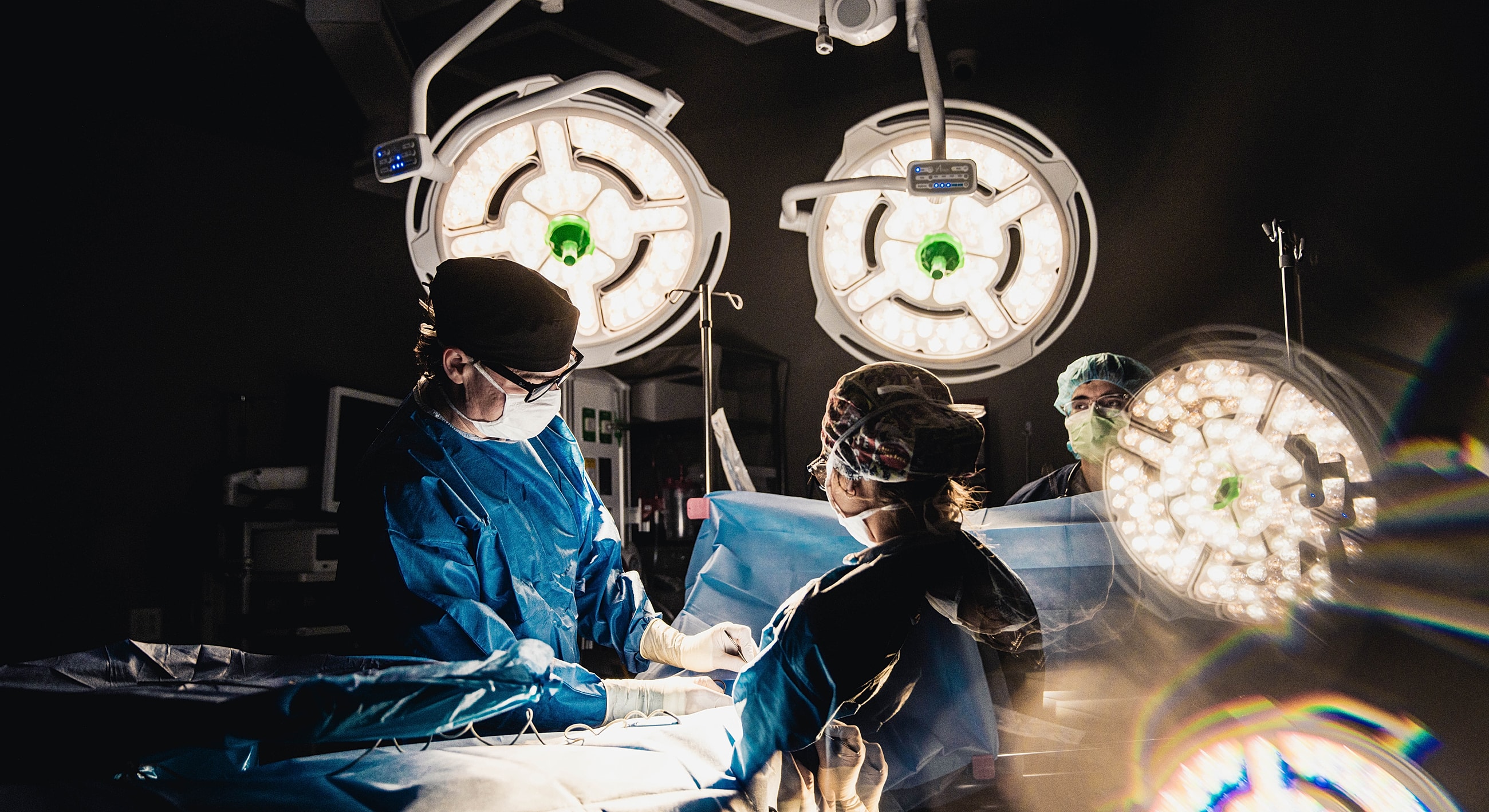 Surgeons performing surgery in an operating room.
